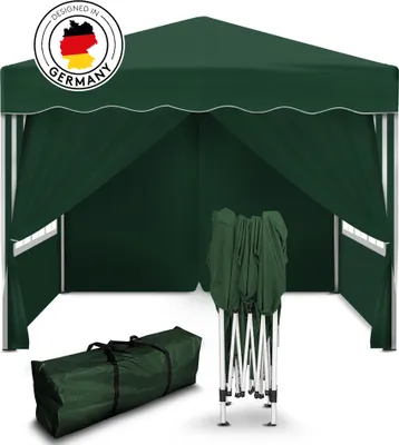 A green pop-up gazebo is shown, partially set up, with a folded frame and a carrying bag in the foreground. A circular logo indicating "Designed in Germany" is visible on the top left.