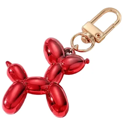 Produktbild von Roter Dog Schlüsselanhänger – Verspielt & Fröhlich KP30478