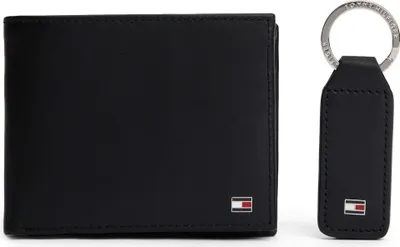 A black leather wallet and keychain set.