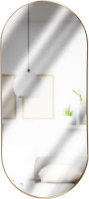 A reflection in an oval mirror shows a room with a pendant light, framed pictures, and a plant.