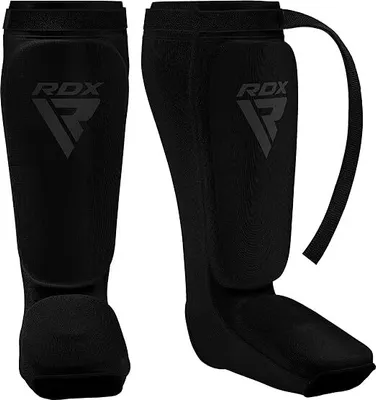 Produktbild von RDX Schienbeinschoner Kickboxen, Schienbeinschützer Thaiboxen Kampfsport Muay Thai MMA Spannschützer, Schienbeinschutz Polster Shin Guard Sparring, Herren Damen Fußschutz Kick Boxing Ausrüstung