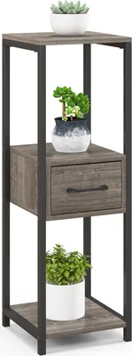 A three-tiered plant stand with a drawer, decorated with potted plants.