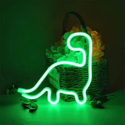 A green neon dinosaur light is displayed in front of a basket filled with yellow and green artificial flowers.
