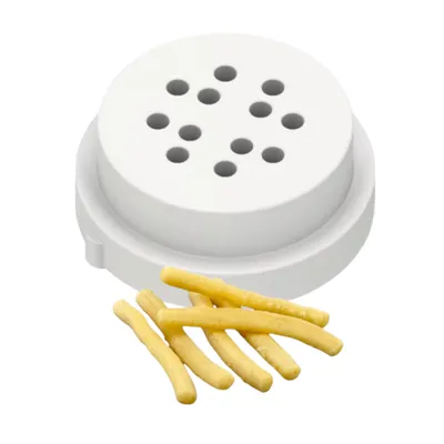 A white pasta maker attachment with several strands of uncooked pasta in front of it.