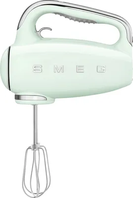 A pastel green Smeg hand mixer with chrome accents is shown against a white background.