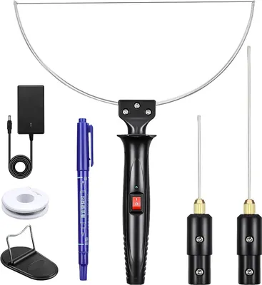 A collection of tools for cutting foam, including a hot wire cutter, power adapter, and replacement wires.