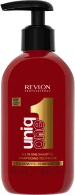 A red bottle of Revlon Professional Uniq One All in One Shampoo with a black pump dispenser.