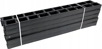 A stack of black plastic edging pieces tied together with white straps, shown from a slightly elevated side angle against a white background.