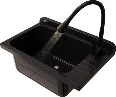 A black sink with a flexible faucet with water running.