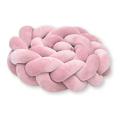A pink braided pillow on a white background.