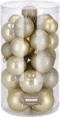 A clear plastic container filled with gold and champagne colored Christmas ornaments.