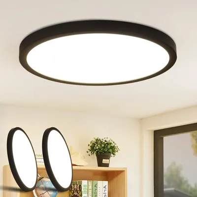 A modern LED ceiling light fixture is shown mounted on a white ceiling, with two smaller, similar light fixtures placed on a shelf below.