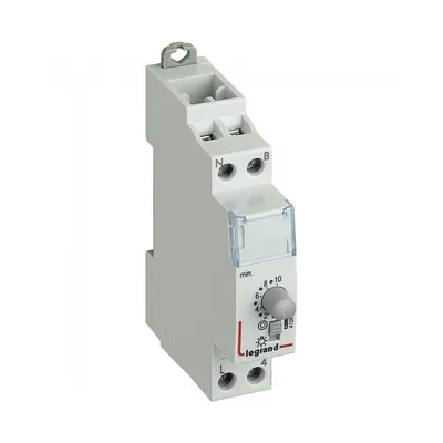 A white electrical timer device with a dial and terminals.