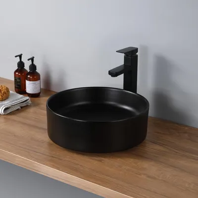 Imagen del producto de Alfombrilla redonda de cerámica negra para lavabo, ideal para el baño