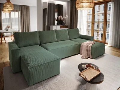 A modern living room scene featuring a large green sectional sofa.
