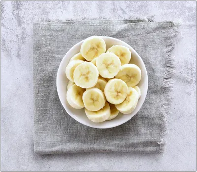 Produktbild von Spritzschutz Herdabdeckplatte Schneidebrett aus Glas Bananen in Schale 1-Teilig (60x52cm)