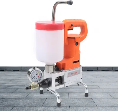 A product shot of an injection machine on a tiled surface with a white background.