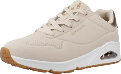 A single beige Skechers sneaker is shown from a side angle against a white background.