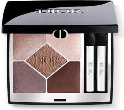 A Dior eyeshadow palette with five shades and two applicators.