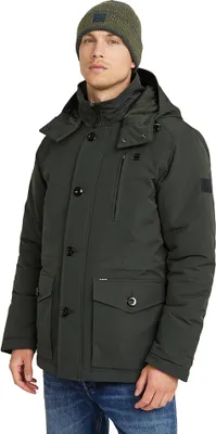 A man wearing a green jacket and a green beanie.