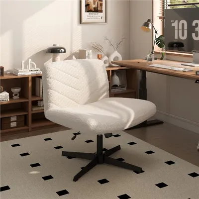 A white fluffy office chair is placed in a home office setting with a wooden desk and shelves.