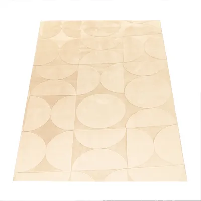 A rug with a geometric pattern of circles and semi-circles, laid out flat on a white background.