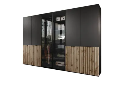 A modern modular wardrobe with dark grey doors and slatted wood panels at the bottom.