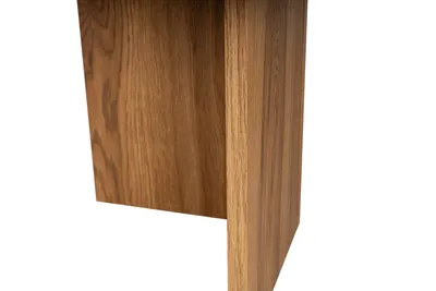 A close-up view of the base of a wooden table.