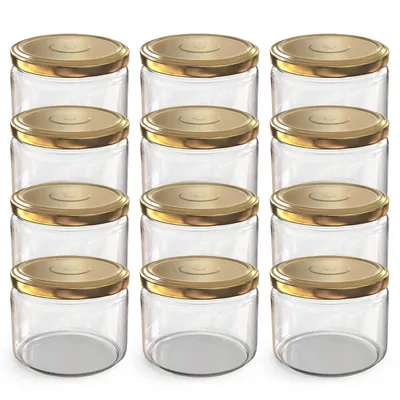 A group of empty glass jars with gold lids arranged in rows.