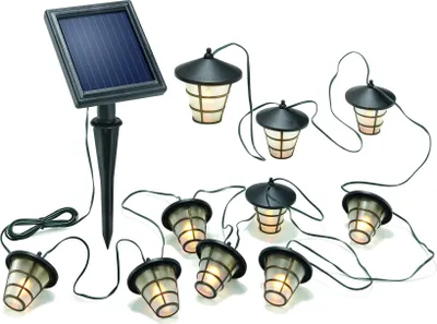A string of solar-powered lantern-style LED lights with a solar panel on a stake.