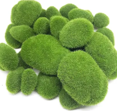 A pile of artificial moss balls of varying sizes.