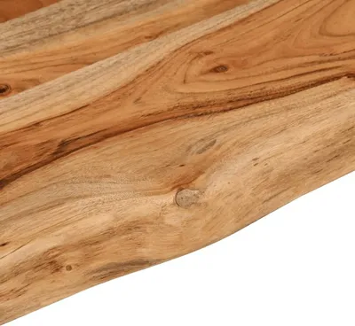 A close-up view of the natural wood grain and live edge of a wooden shelf.