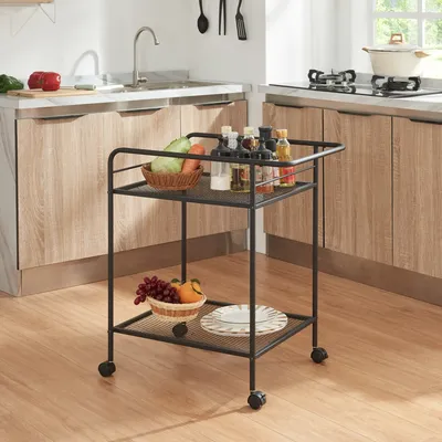 A kitchen scene with a rolling cart filled with kitchen items.