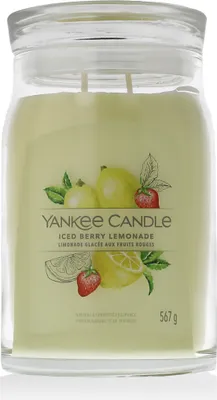 A Yankee Candle jar with a label showing illustrations of lemons, strawberries, and mint leaves.