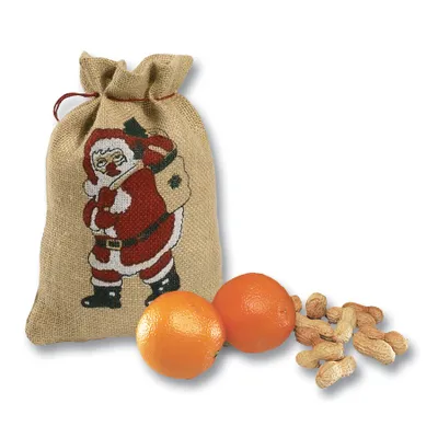 A Christmas sack with Santa Claus design, two oranges, and peanuts on a white background.