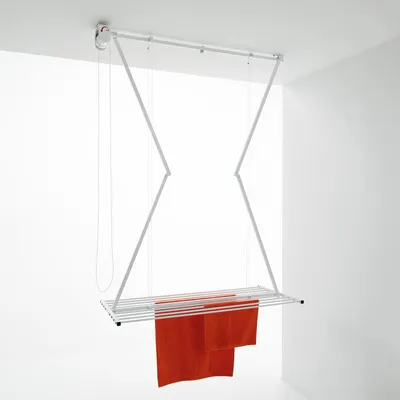 A ceiling-mounted clothes drying rack with orange towels hanging from it, shown in a clean, white room.