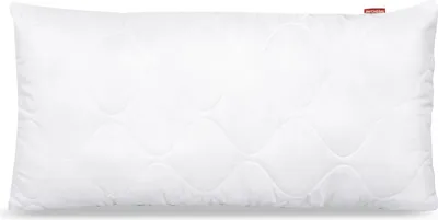 A white, quilted pillow is shown lying flat against a white background.