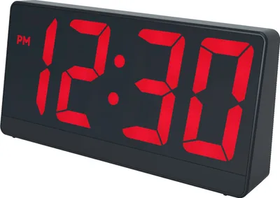 A digital alarm clock with a red LED display showing the time.