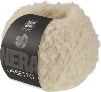 A ball of fluffy, cream-colored yarn with a black label wrapped around it.