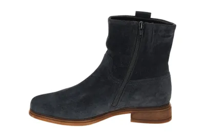 A side view of a blue suede boot with a brown sole and a zipper.