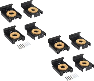 A collection of black brackets with cork inserts, along with screws and wall anchors.