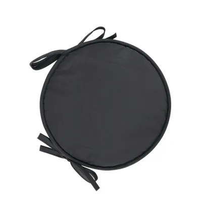 A black round seat cushion with ties is shown against a white background.