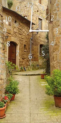 Produktbild von Wallario Design Wanduhr Weg durch die Altstadt - Toskana in Italien aus Echtglas, Größe 30 x 60 cm