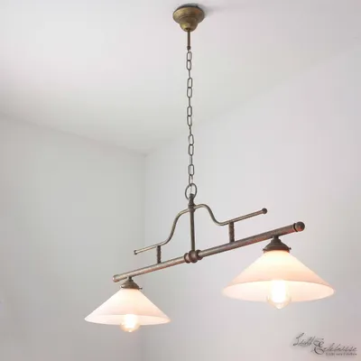 A hanging lamp with two glass shades is shown against a white background.