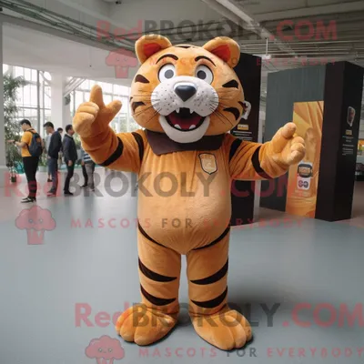 Produktbild von Maskottchenkostüm REDBROKOLY eines braunen Tigers mit Langarm-T-Shirt und Broschen