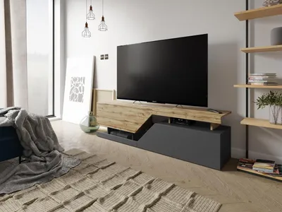 A modern living room with a TV stand and a television.