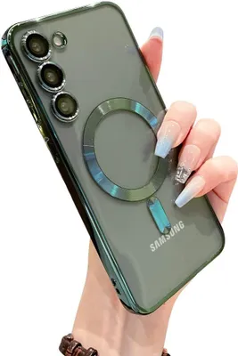 A hand holding a green phone case with a magnetic ring on the back.