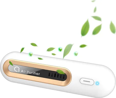 A white and gold portable air purifier with green leaves floating around it.