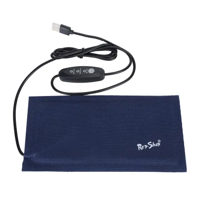 A blue heating mat with a USB cable and controller is laid out on a white background.