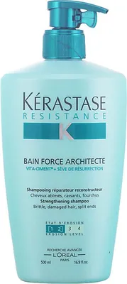 A bottle of Kerastase shampoo with a pump dispenser.